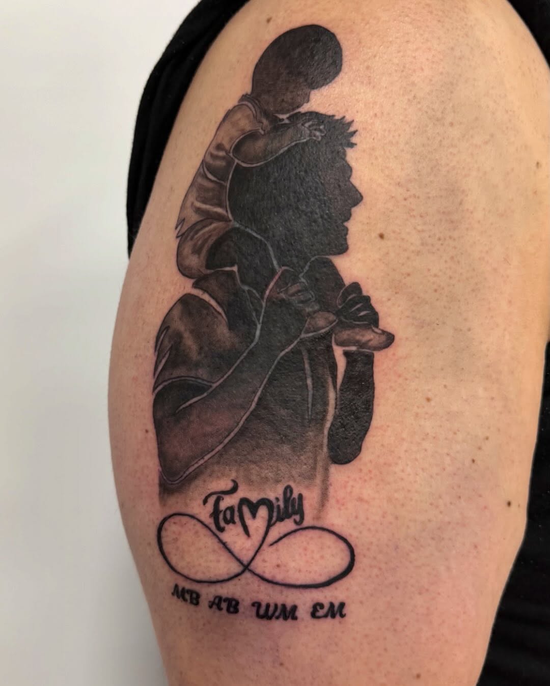 Father and child realism tattoo on the shoulder by Bailee
