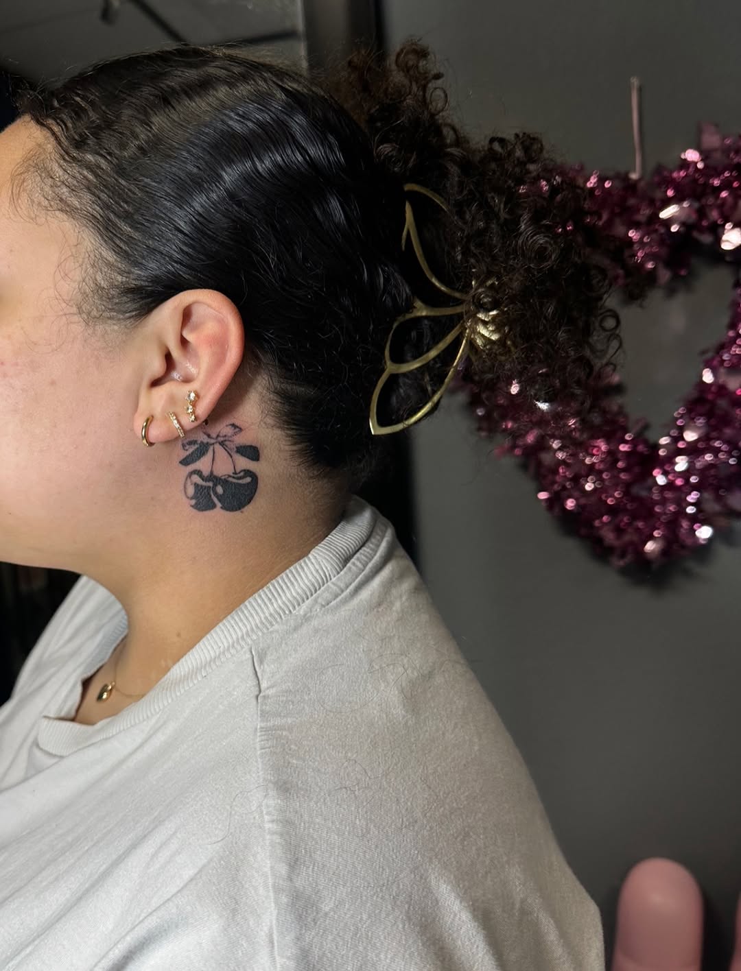 Cherries tattoo on the neck by Lupita Ink