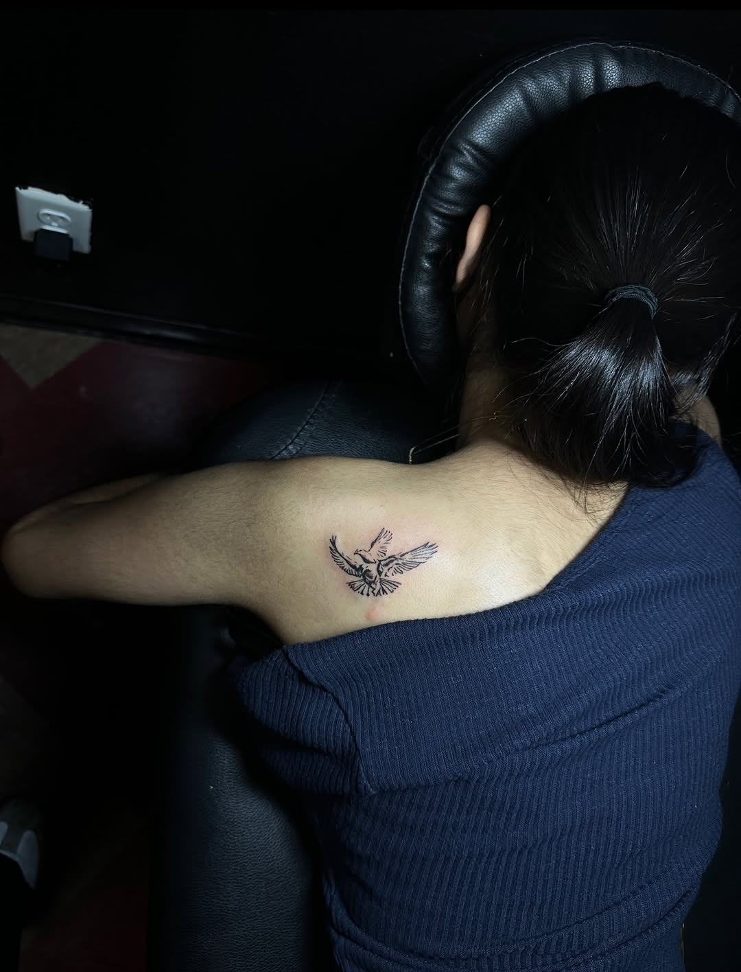 Two birds fine line tattoo on the upper arm by Lupita Ink