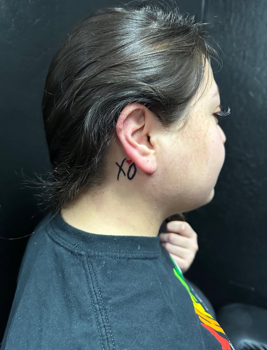 XO with heart cyber sigilism tattoo on the neck by Lupita Ink