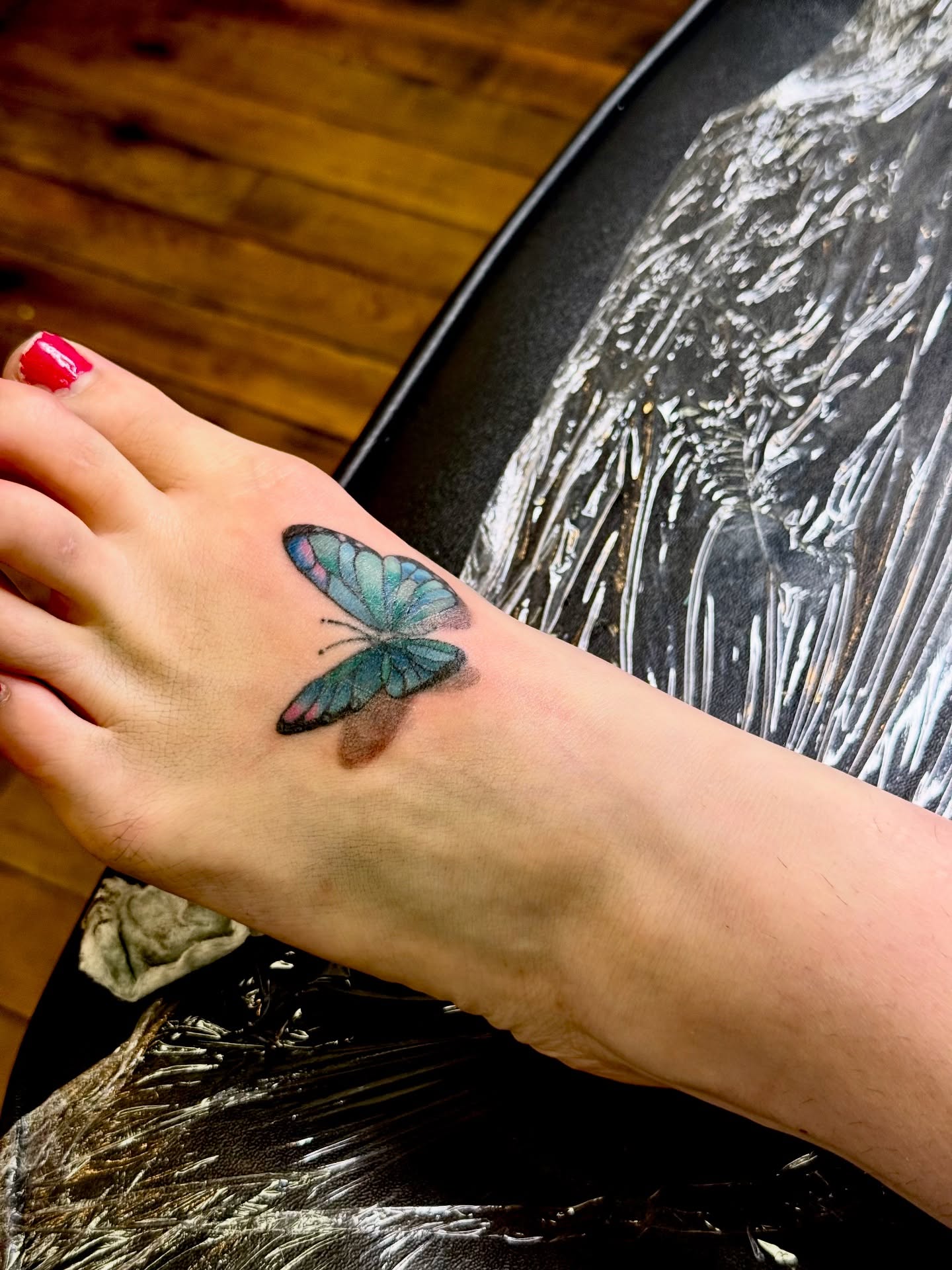 Butterfly realism tattoo on the foot by Whimsy Ink