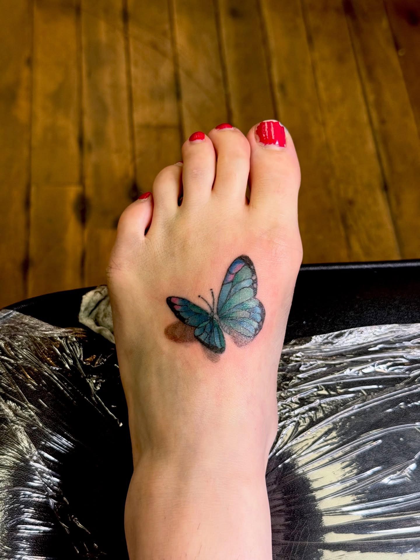 Butterfly realism tattoo on the foot by Whimsy Ink