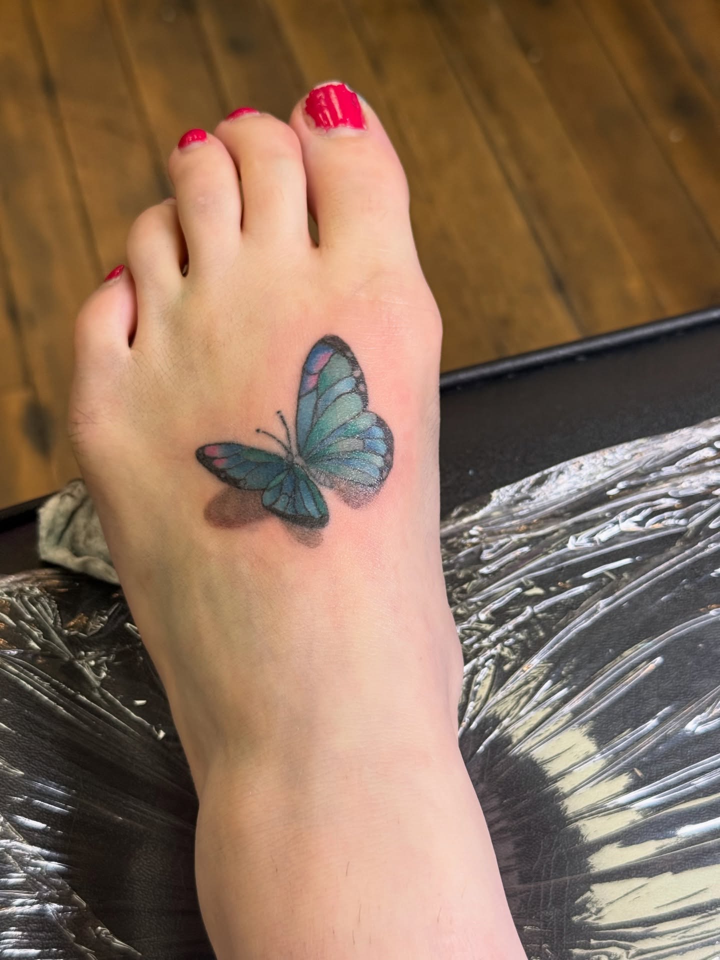 Butterfly realism tattoo on the foot by Whimsy Ink
