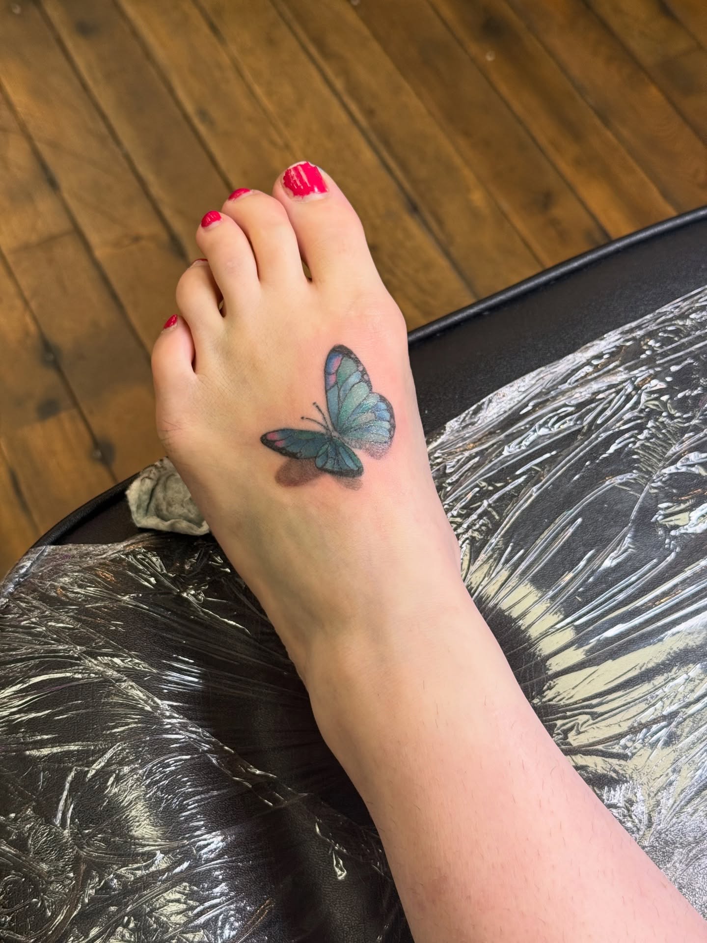 Butterfly realism tattoo on the foot by Whimsy Ink