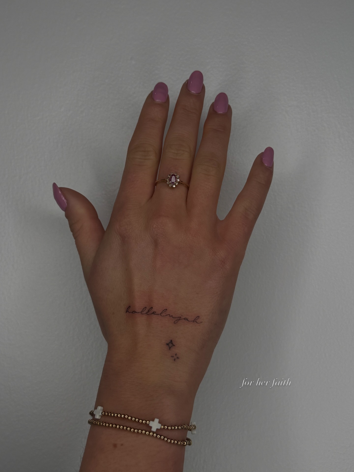 Hallelujah lettering script tattoo on the hand by Ryleigh Benjamin