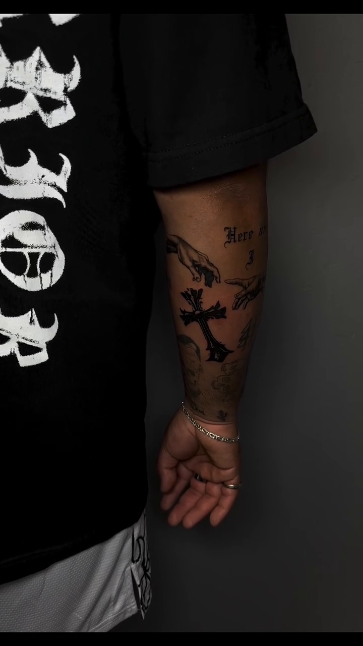 Cross and hands tattoo lettering tattoo on the forearm by Lupita Ink