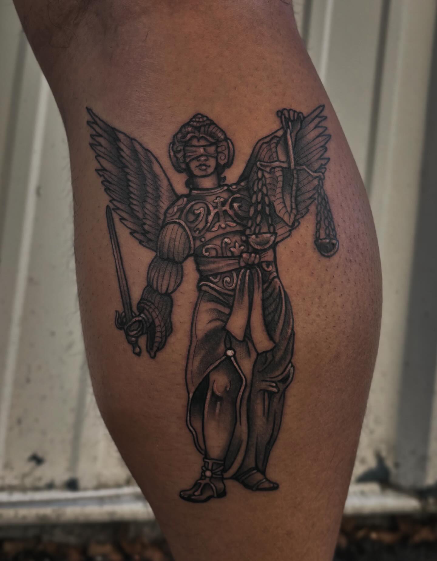 Angelic warrior black and grey tattoo on the thigh by Mim