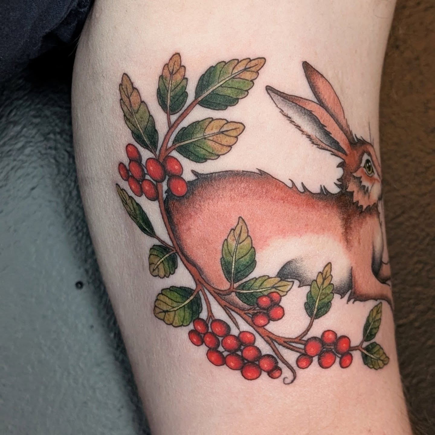 Rabbit and berries realism tattoo on the forearm by π²π°πket
