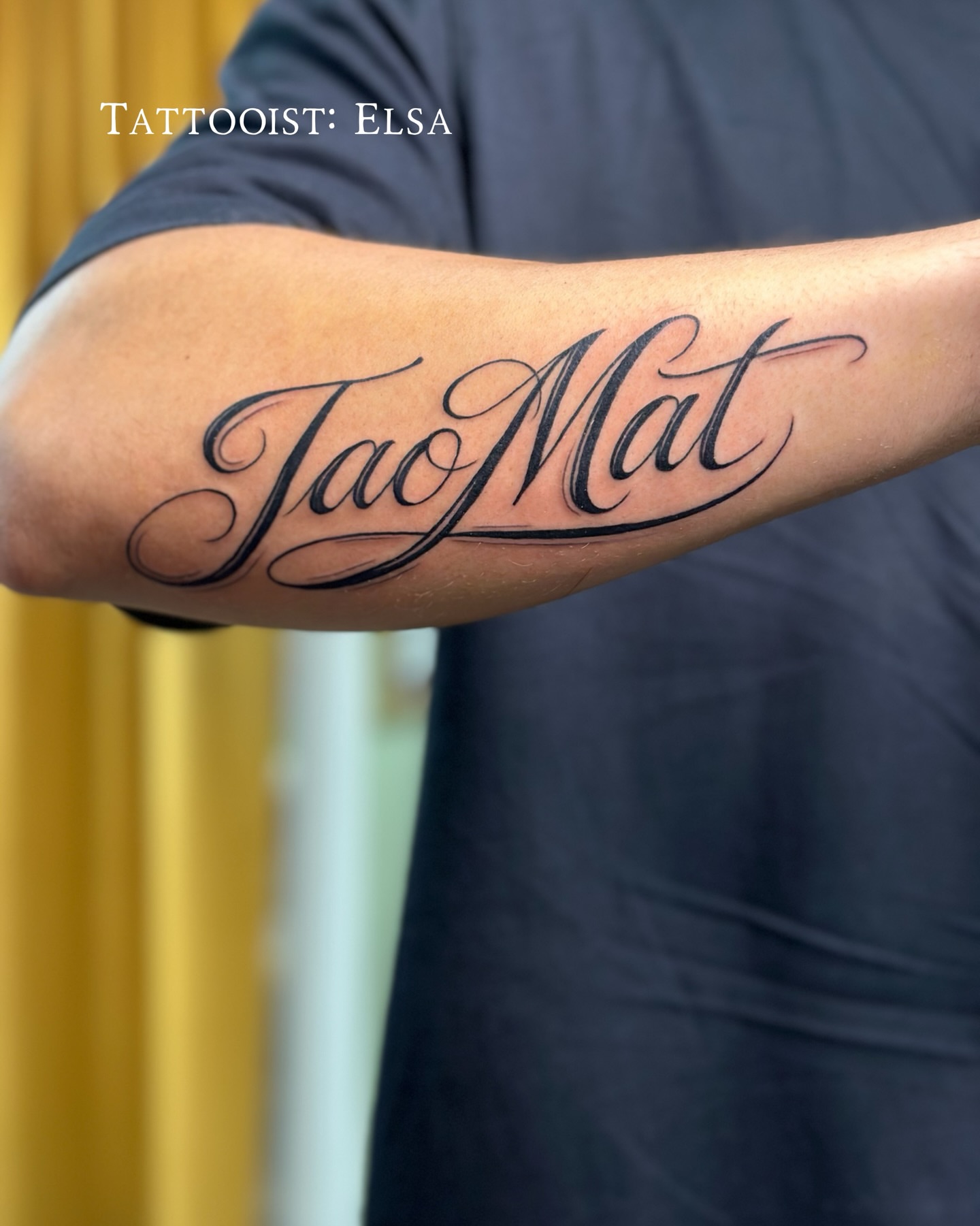 TaoMat lettering script tattoo on the forearm by Lyndsay Southgate
