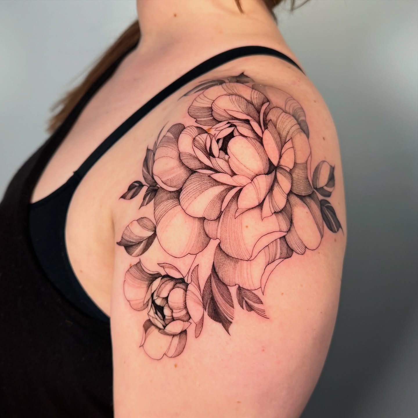 Peony bouquet black and grey tattoo on the shoulder by Cyn