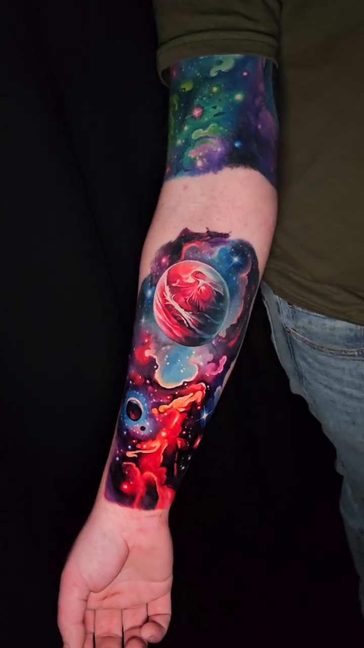 Astronaut in space realism tattoo by Tyler Malek