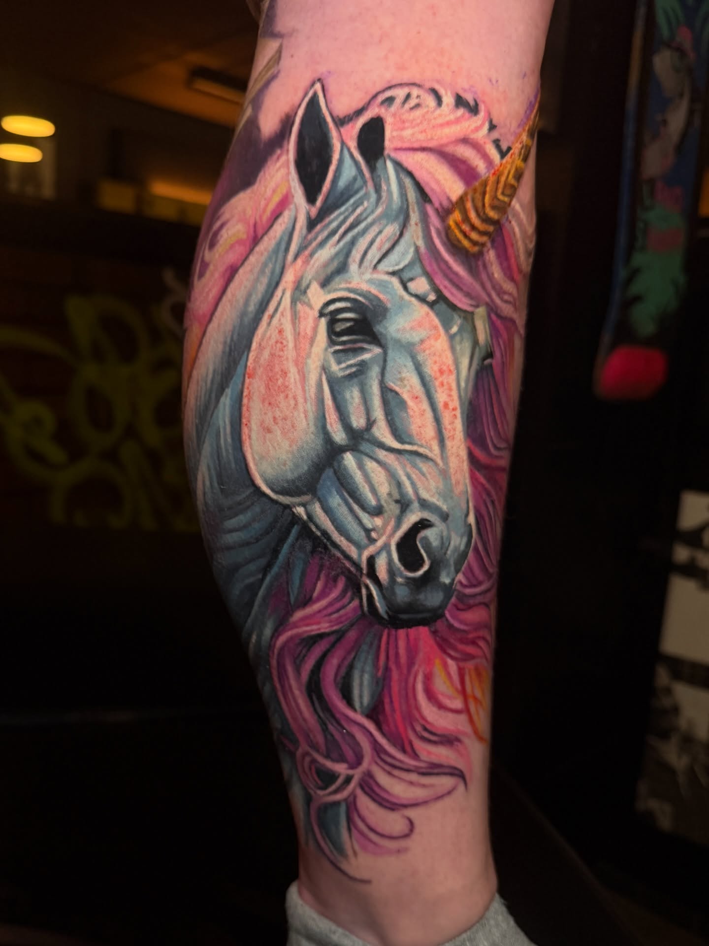 Unicorn realism tattoo on the forearm by Scott Pizer