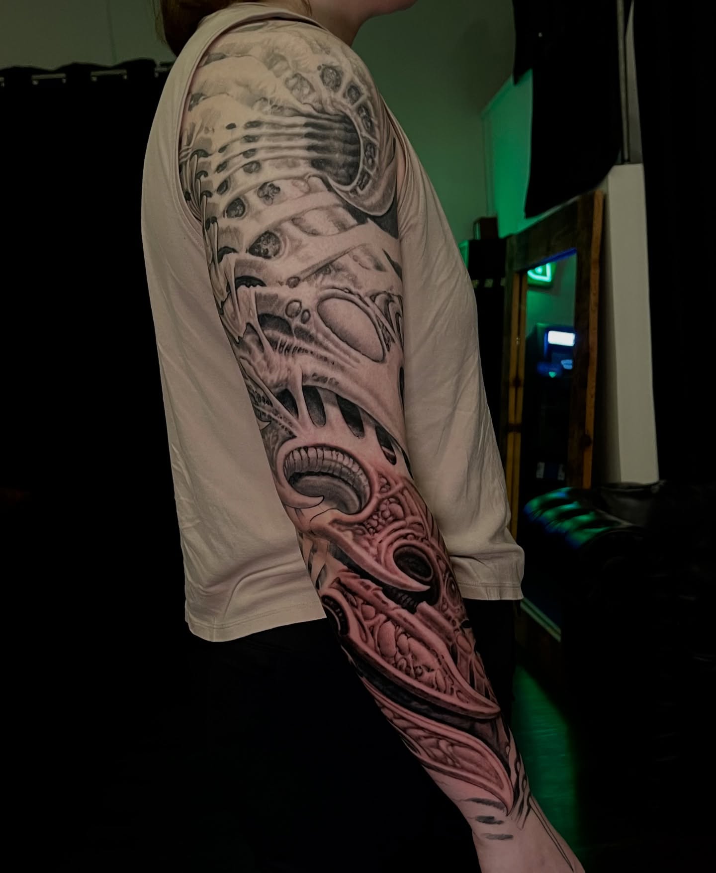 Cyborg biomechanical arm realism tattoo on the upper arm by Shaine Smith, Durham, North Carolina