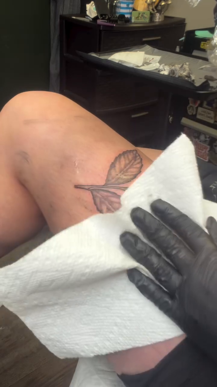 Feather tattoo tattoo on the thigh by K. Bel Art