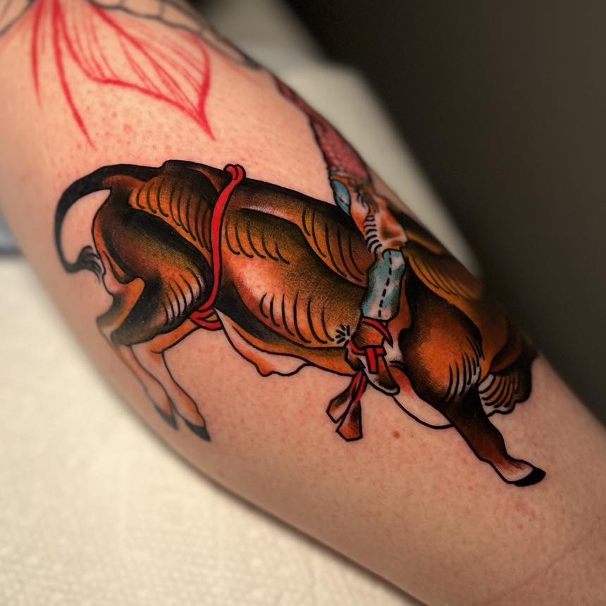 Bull American traditional tattoo on the forearm by Haylie Adele Strong