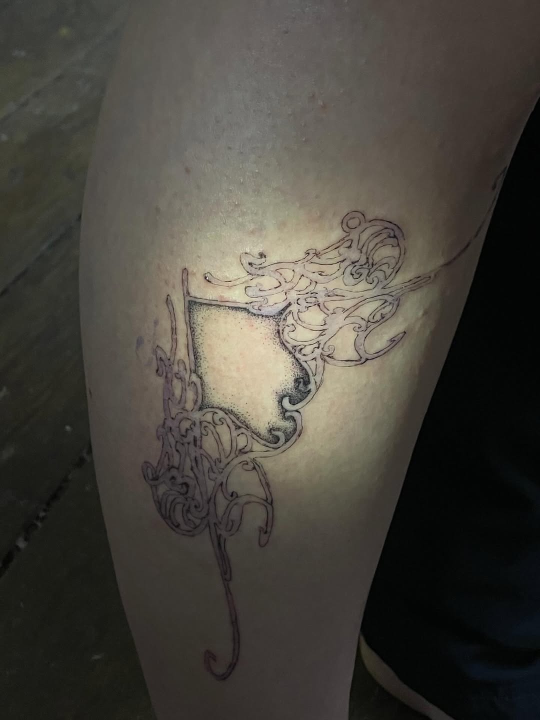 Abstract ornamental design sketch tattoo on the leg by Sashka