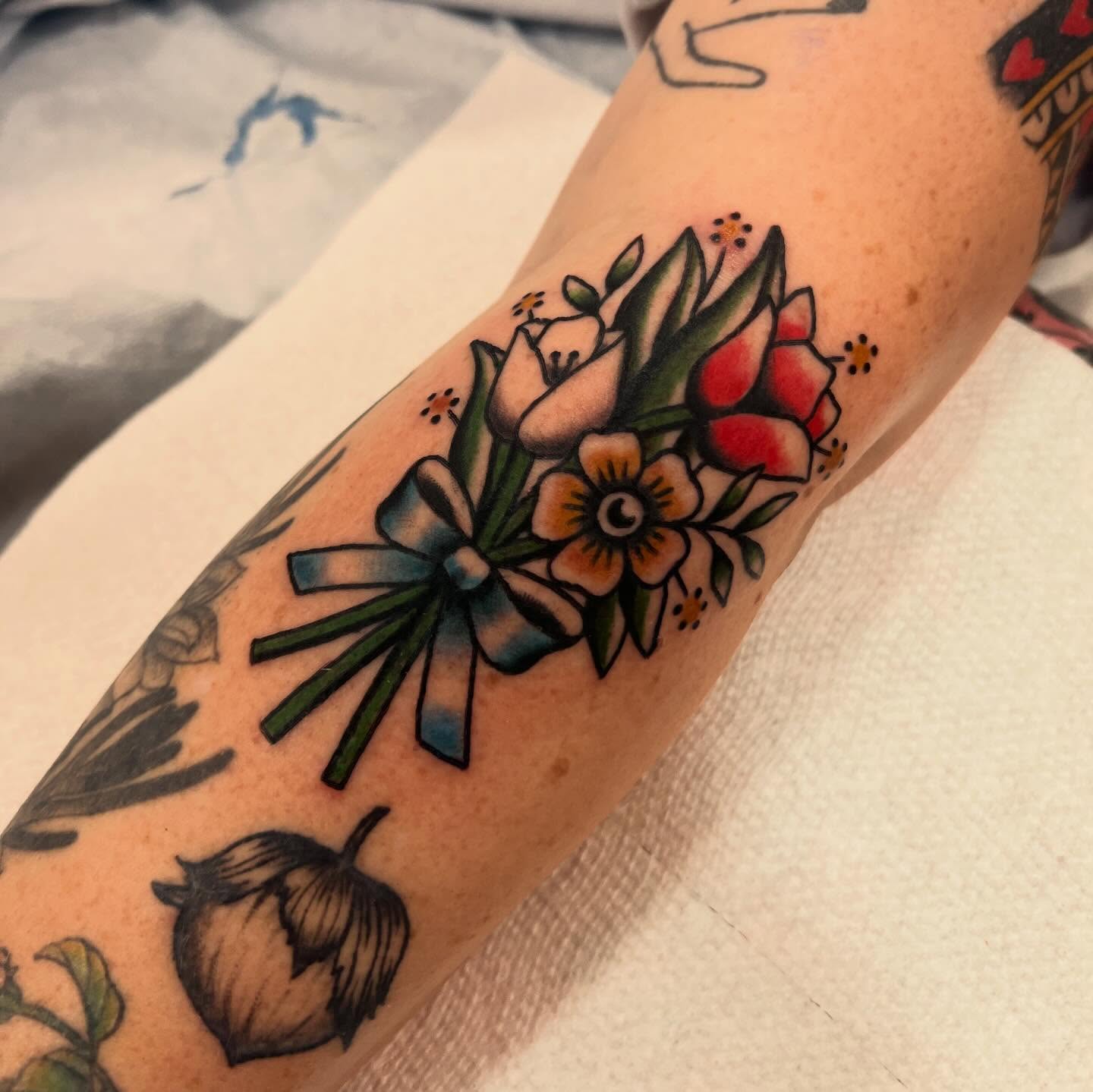 Flower bouquet American traditional tattoo on the forearm by Samantha Citer