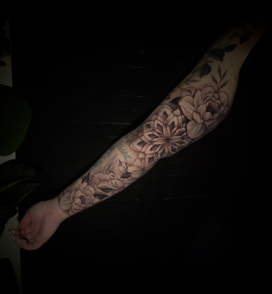 Floral mandala geometric tattoo on the forearm by Sad Girl Tattoos
