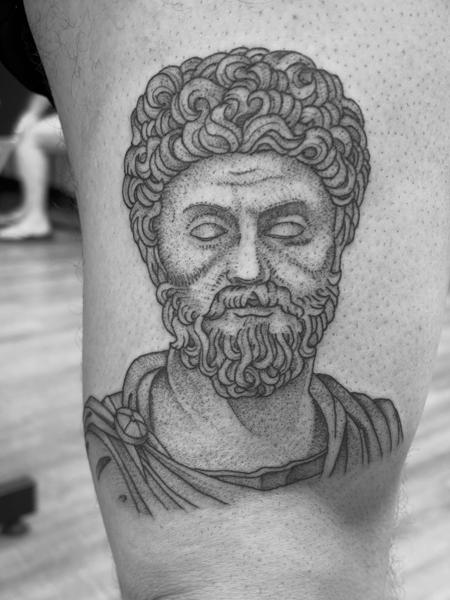 Ancient bust dotwork tattoo on the thigh by Jason Allen, Avondale, Arizona