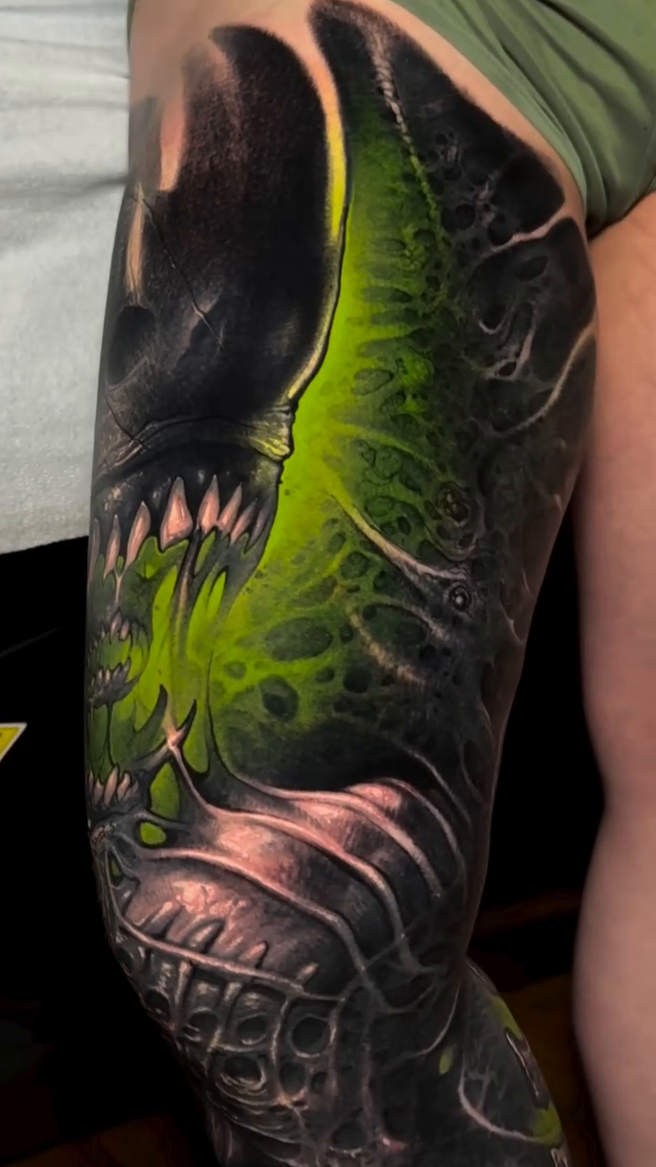 Alien creature dark realism tattoo by Brandon Herrera