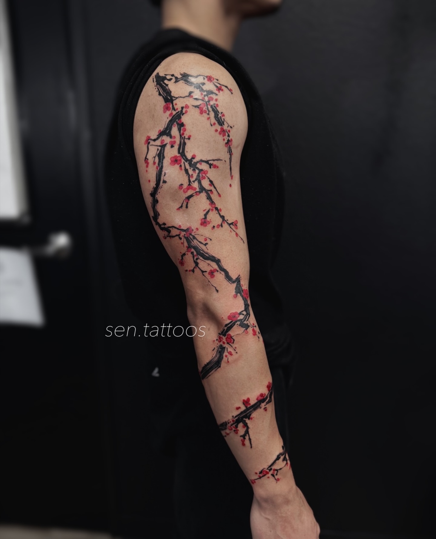 Cherry blossom branches dotwork tattoo on the forearm by Sen Tattooer