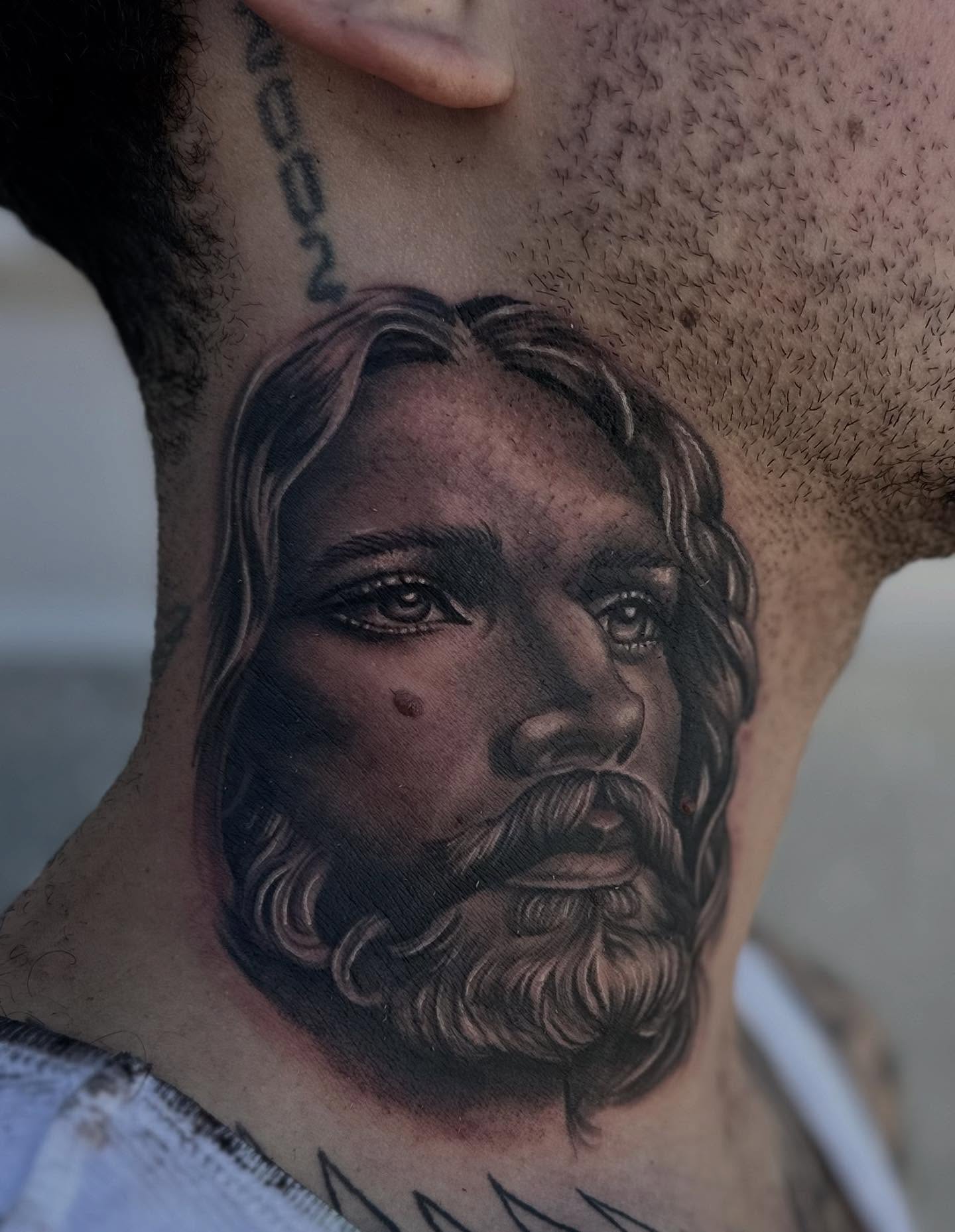 Religious figure realism tattoo on the neck by Ruben