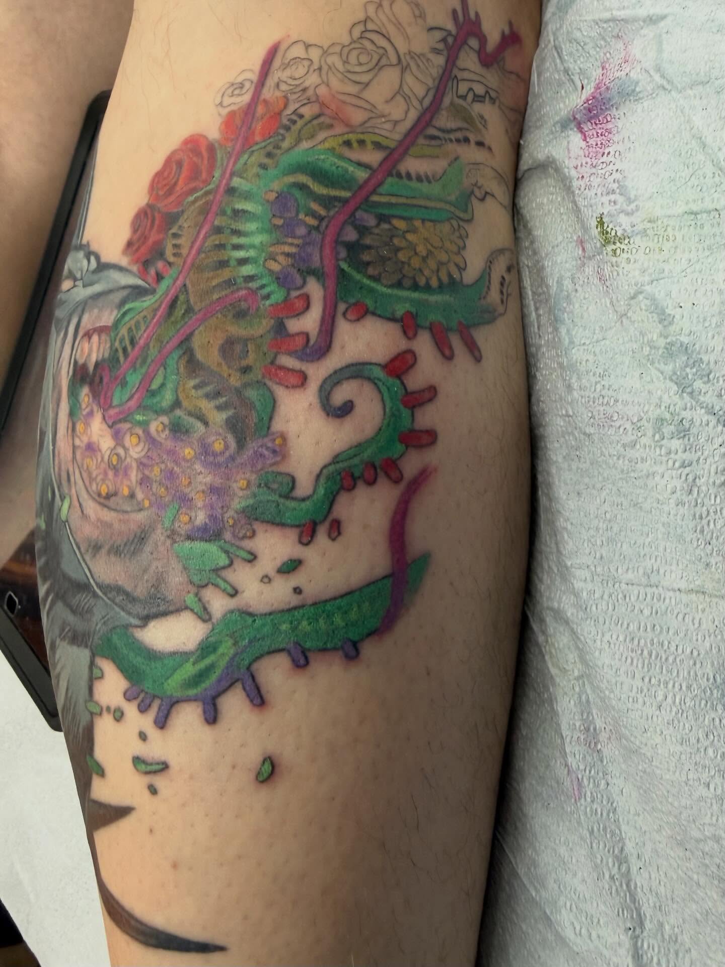 Dragon and floral new school tattoo on the forearm by Hori Bensei, Charlottesville, Virginia
