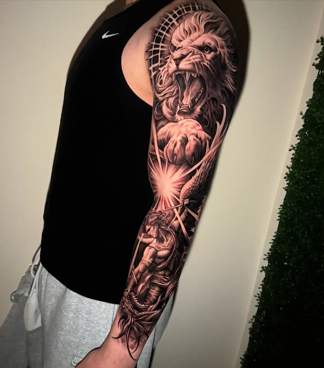 Lion and angel sleeve Japanese tattoo on the forearm by Grace P