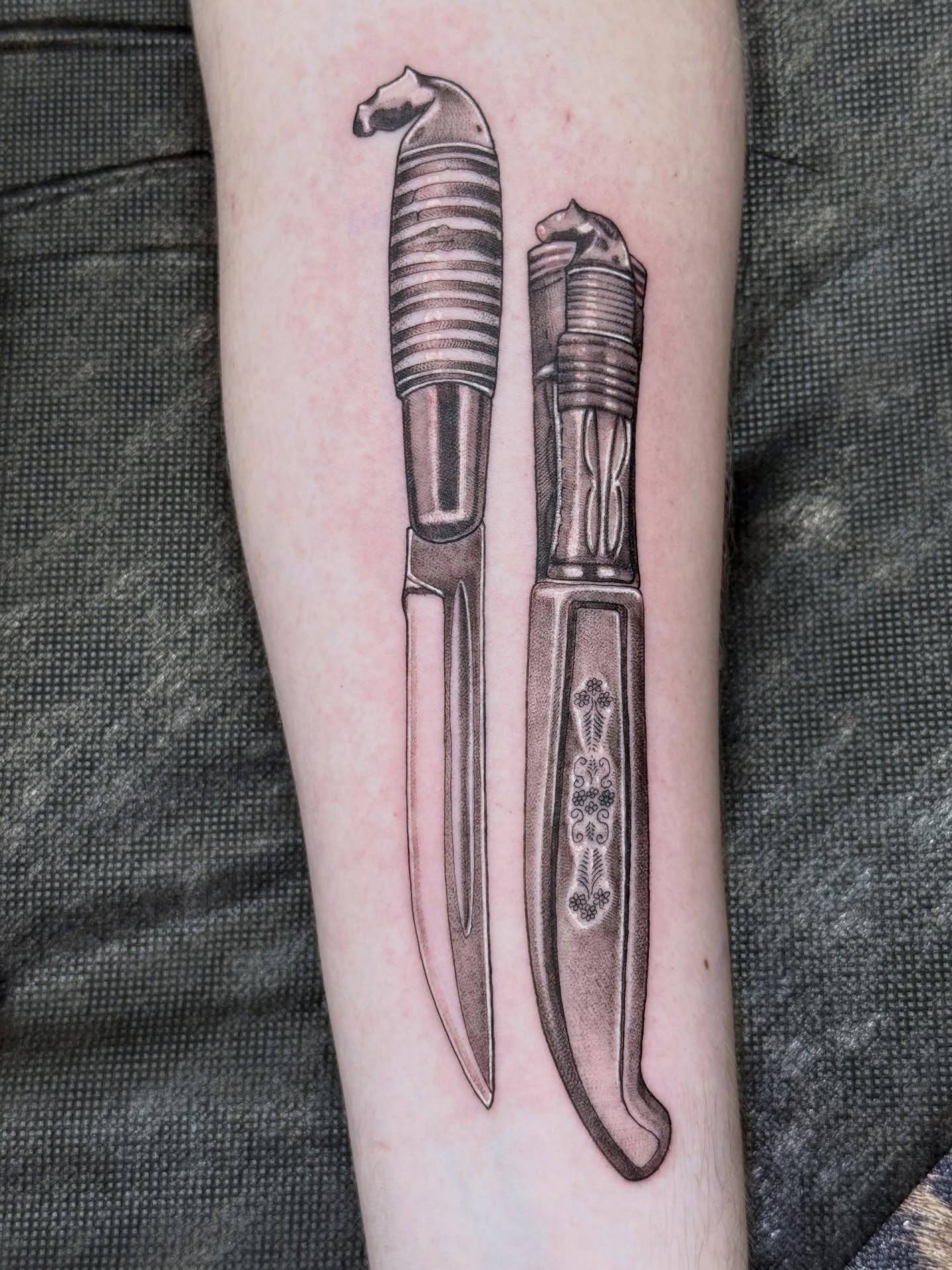 Knives realism tattoo on the forearm by Lydia Jude