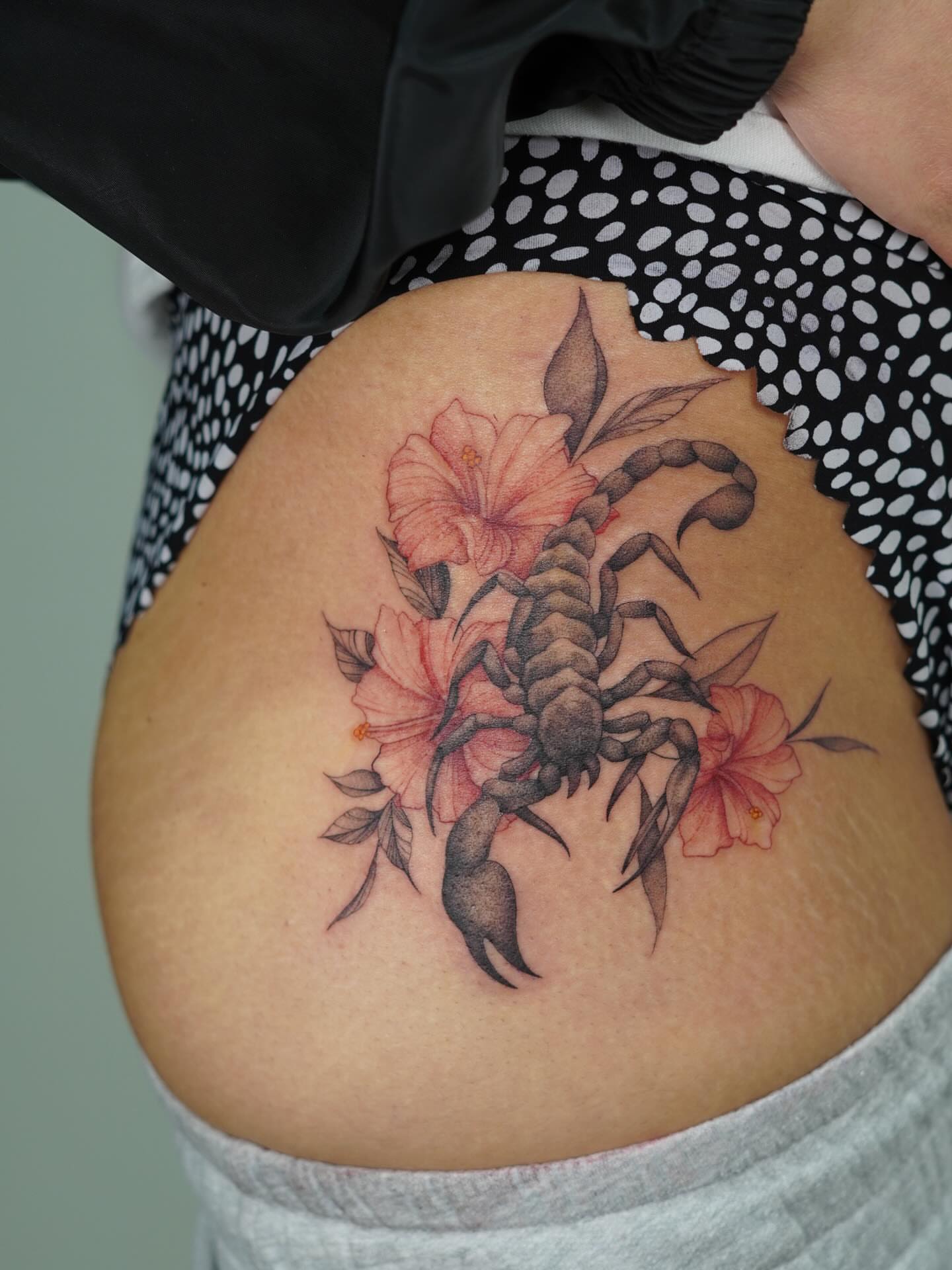Scorpion and flowers realism tattoo by Danae Andino