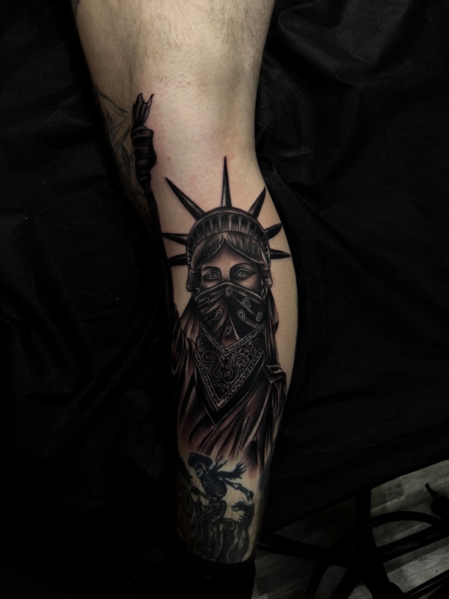Statue of liberty black and grey tattoo on the forearm by Zeus