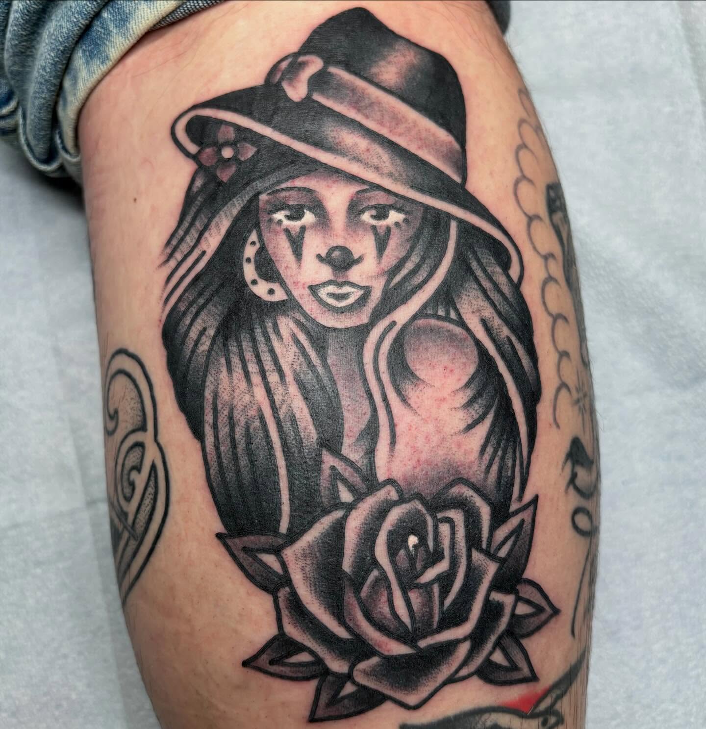 Woman with hat and rose American traditional tattoo on the thigh by ~pooty~