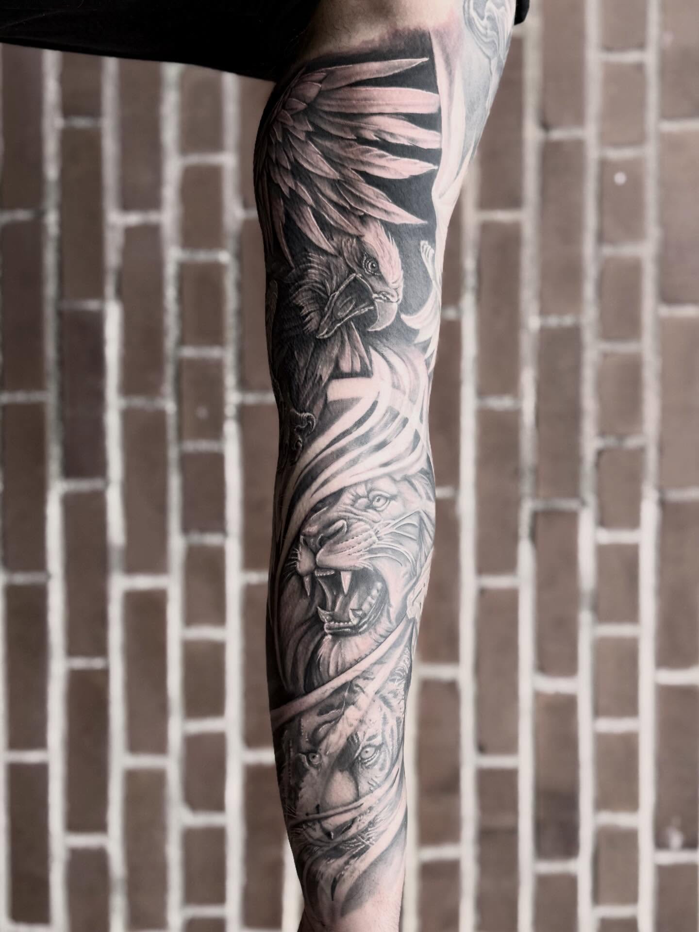 Lion and eagle realism tattoo on the forearm by Blake Van Vleck