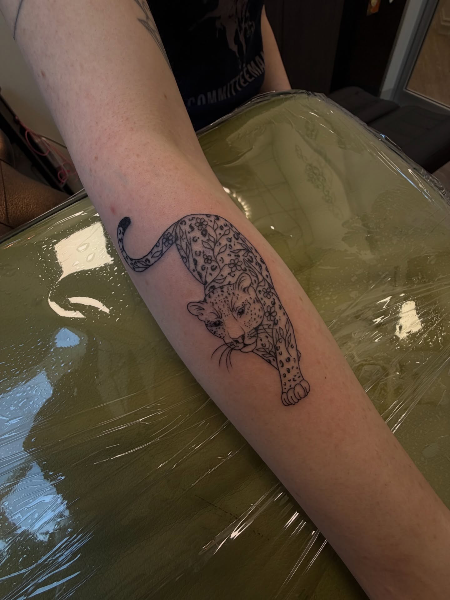 Leopard black and grey tattoo on the forearm by ashlyn rene