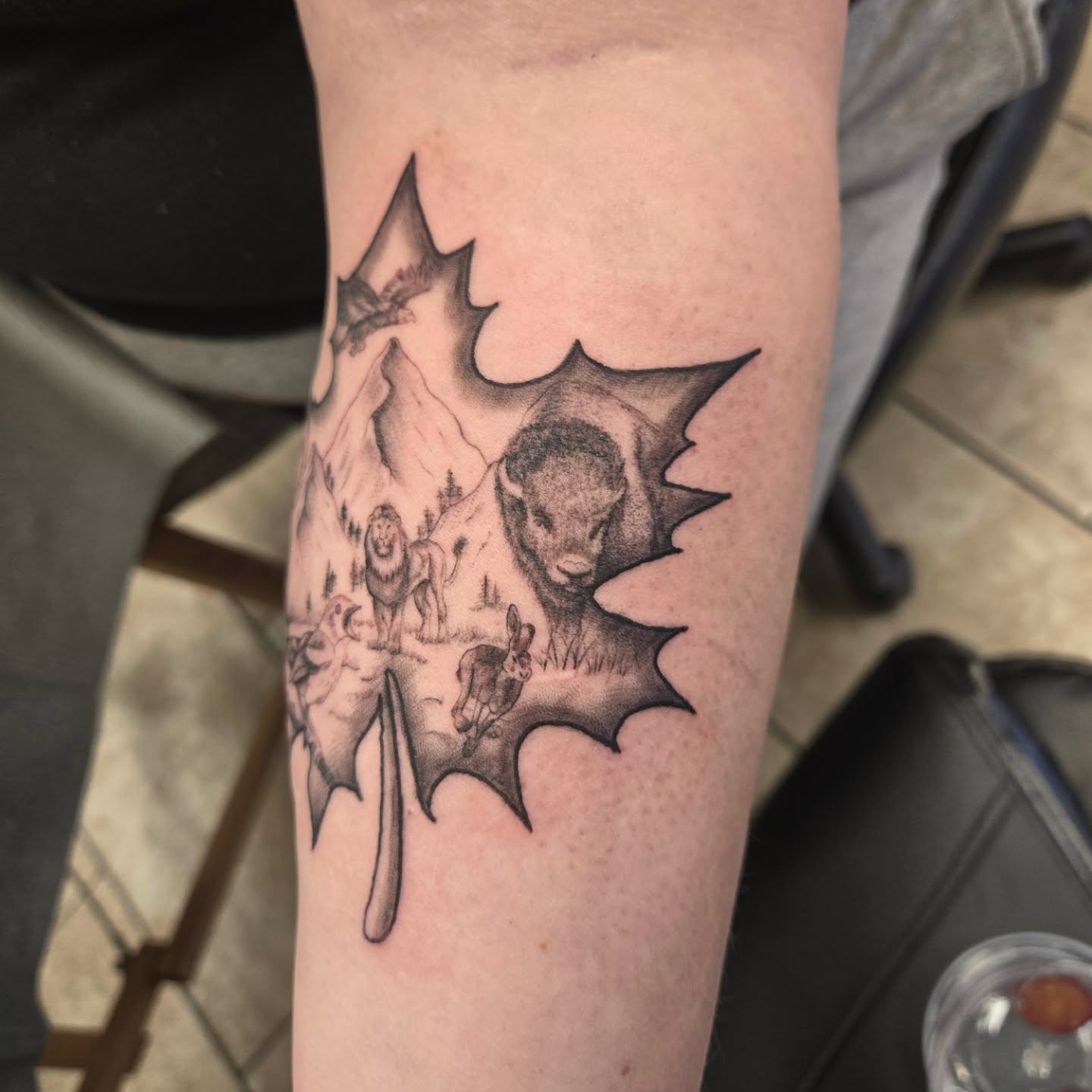 Maple leaf with wildlife black and grey tattoo on the forearm by Jose G. Rubio Tattoo Artist πΊπ²ππ¨π¦