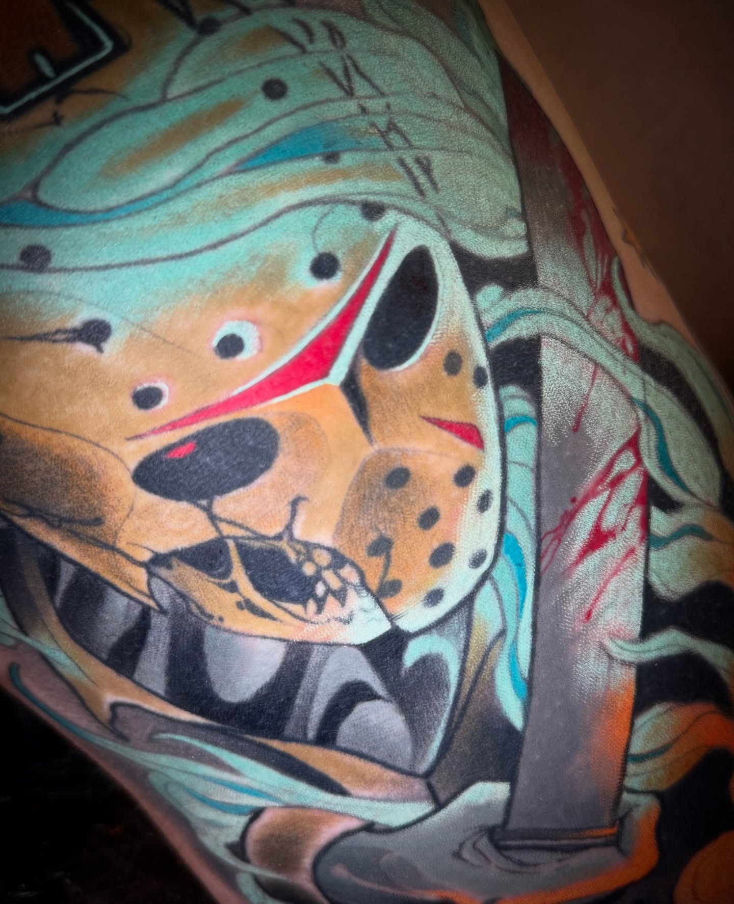 Jason voorhees mask trash polka tattoo on the upper arm by Emmanuel Mendoza