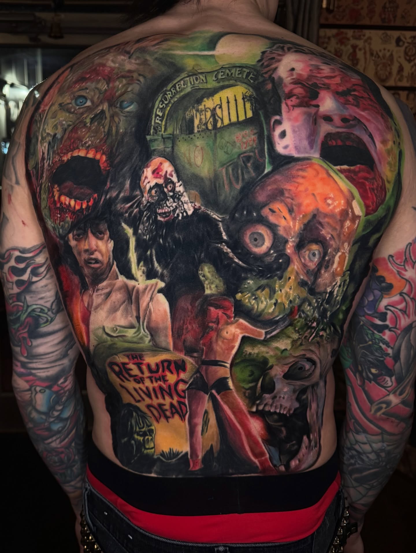 Zombie horror realism tattoo on the back by Sideshow Danny