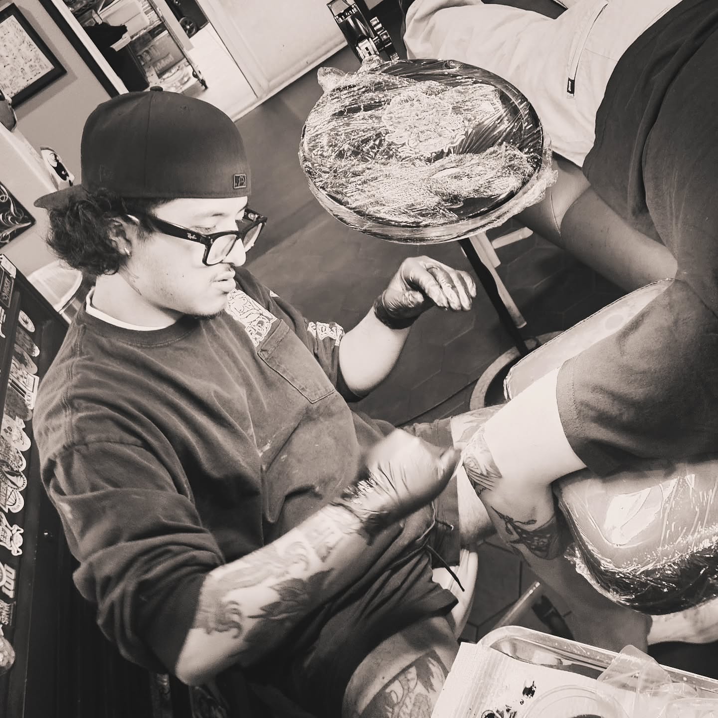 Tattoo artist black and grey tattoo on the upper arm by Kat Fishbein