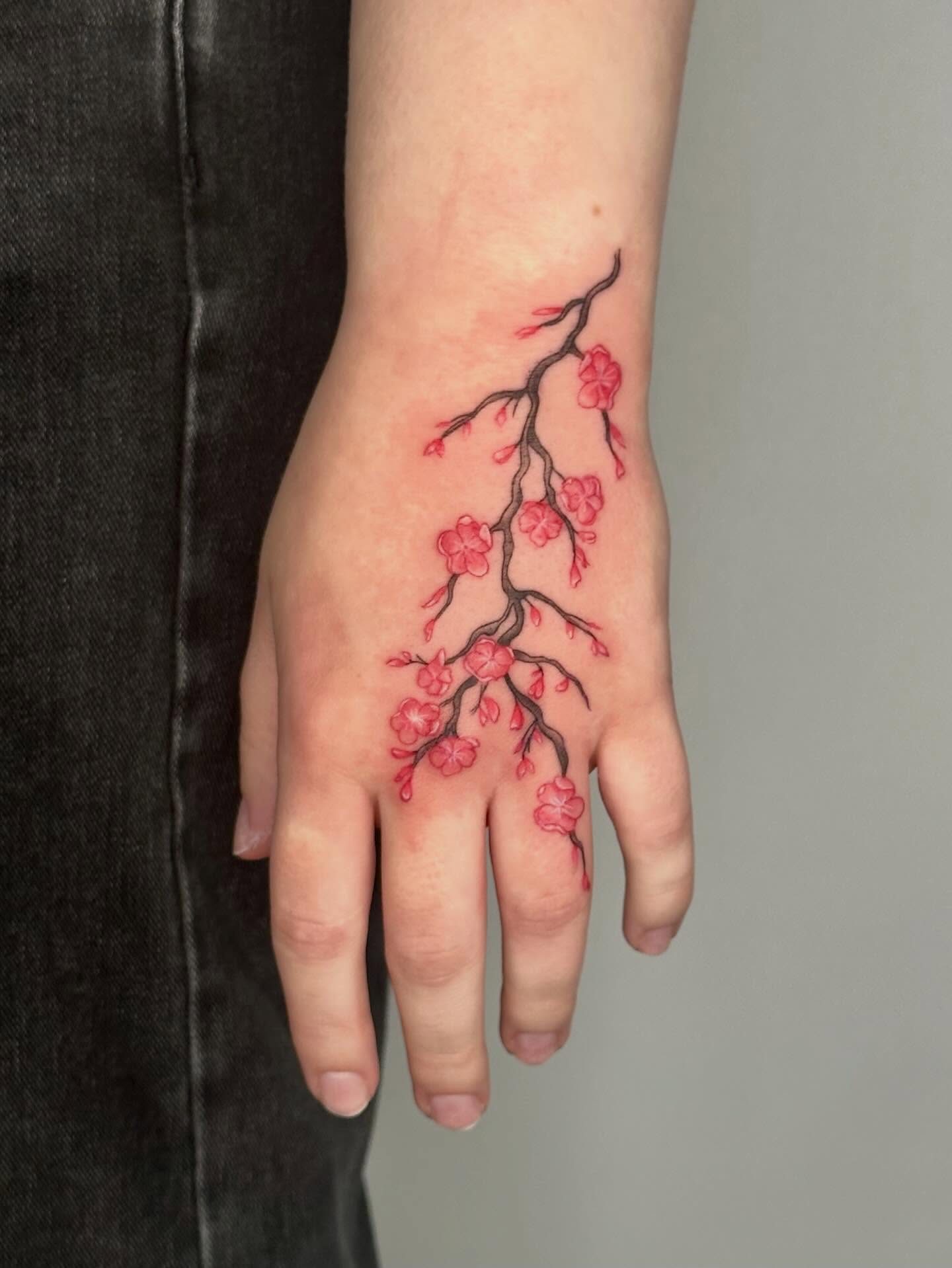 Cherry blossom branch dotwork tattoo on the hand by 🌼Kristen Kooster Tattoos🌼