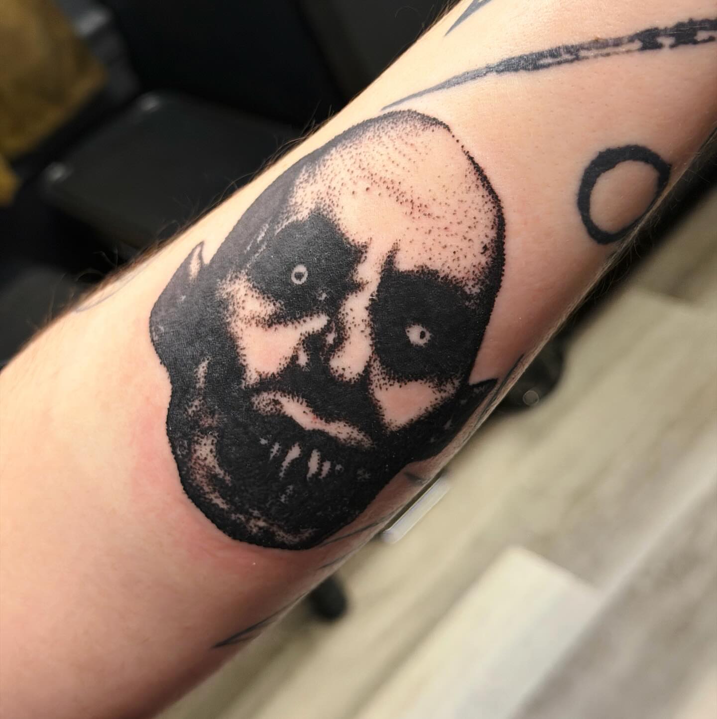 Portrait dotwork tattoo on the forearm by Emily