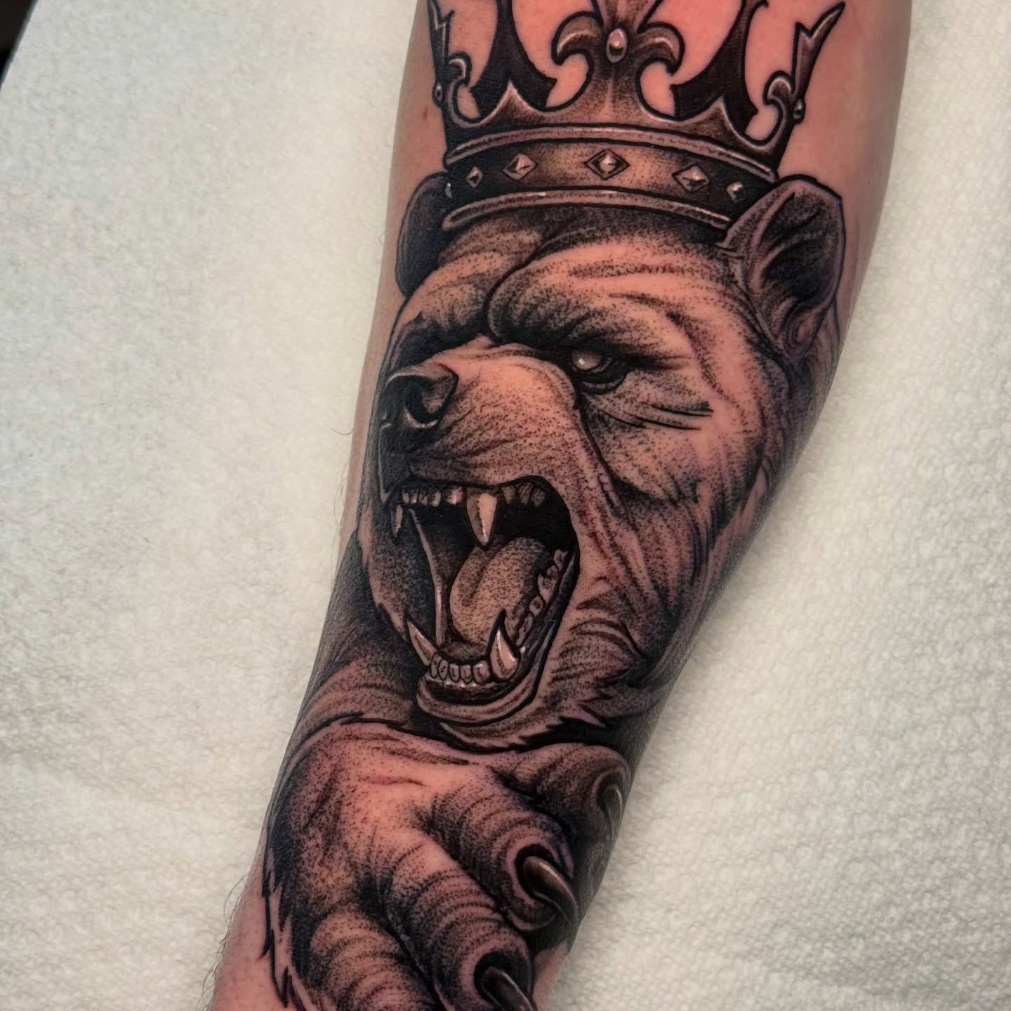 Angry gorilla realism tattoo on the forearm by Justin Hay