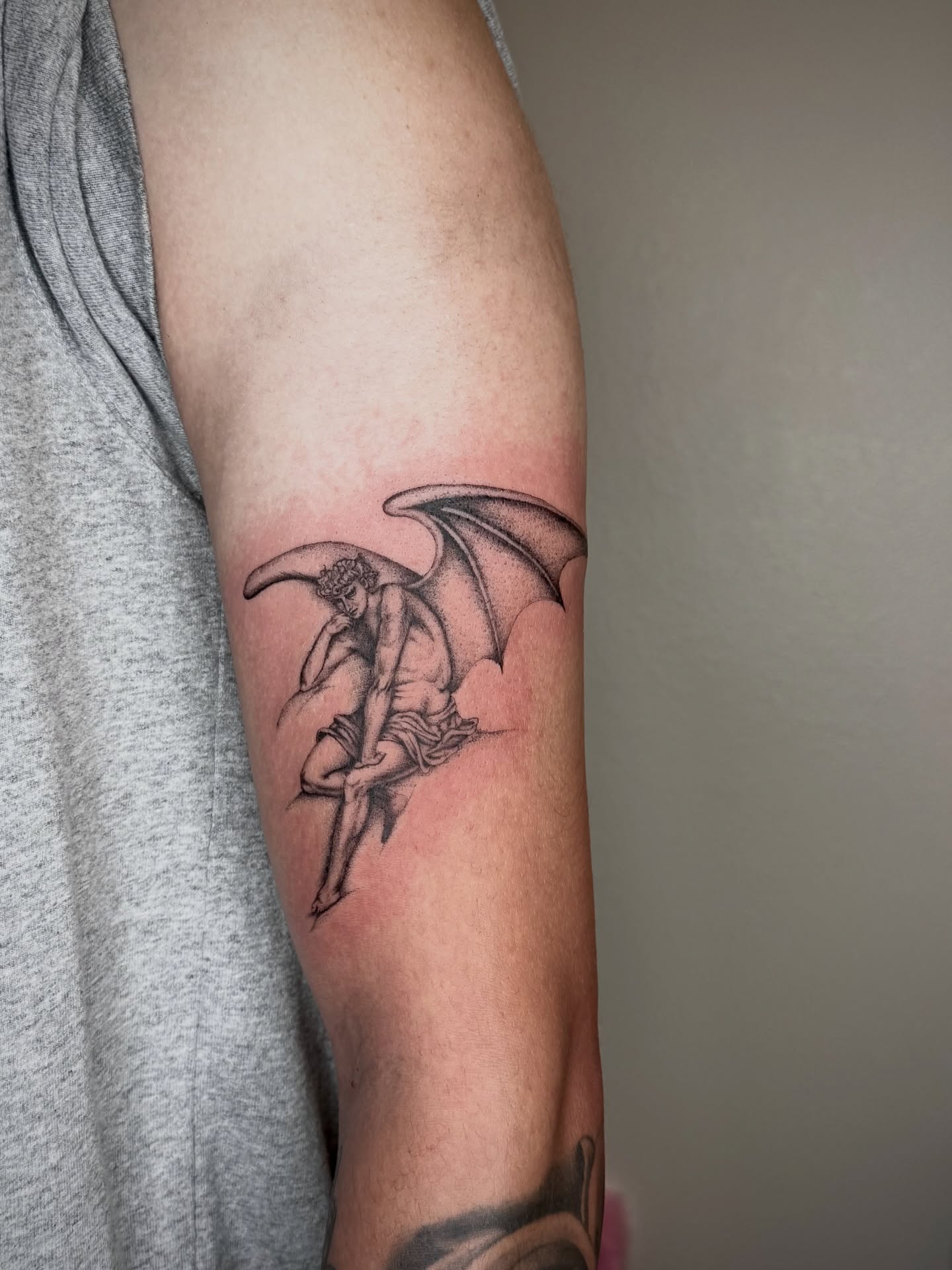 Angelic figure with wings black and grey tattoo on the forearm by Zornitsa ☆