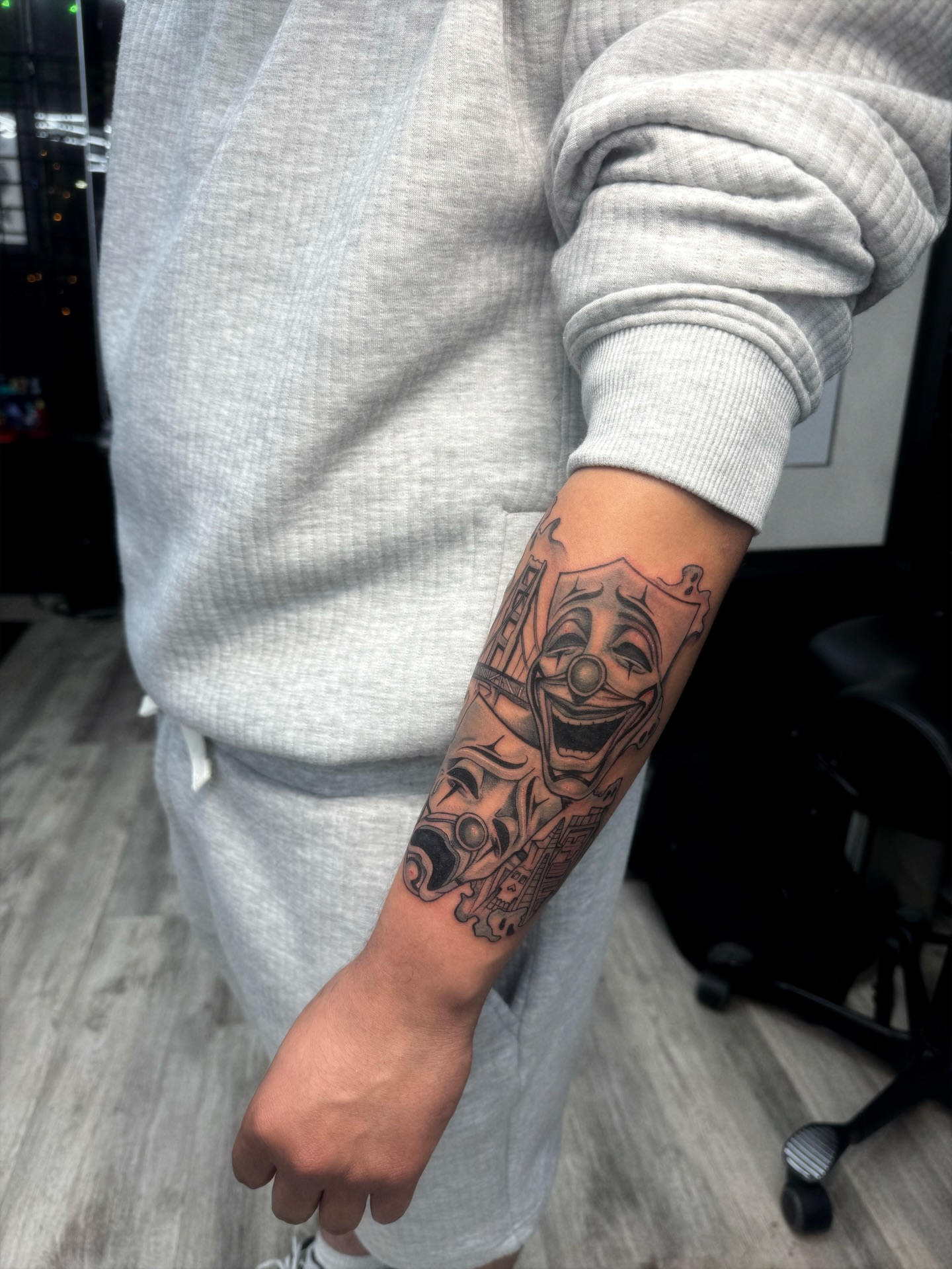 Clown mask black and grey tattoo on the forearm by 🕸️EC🥷🏼🌁🇲🇽🕸️