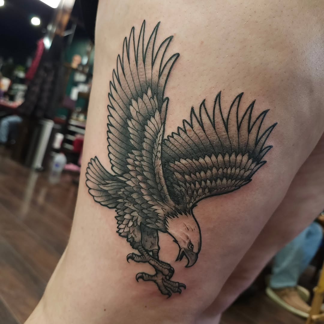 Eagle realism tattoo on the thigh by Chris Wodarski