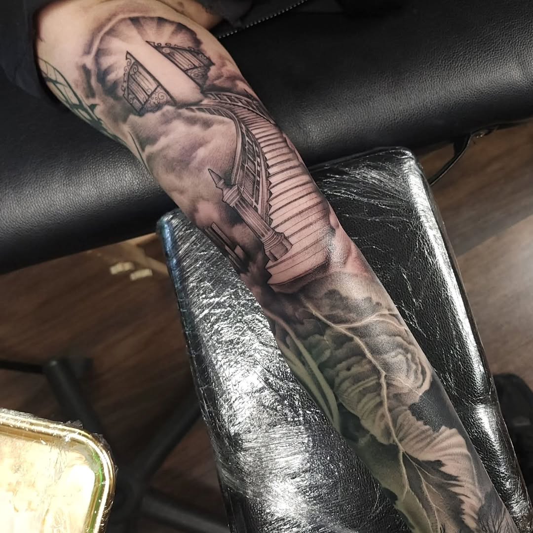 Stairway to heaven realism tattoo on the forearm by Chris Wodarski