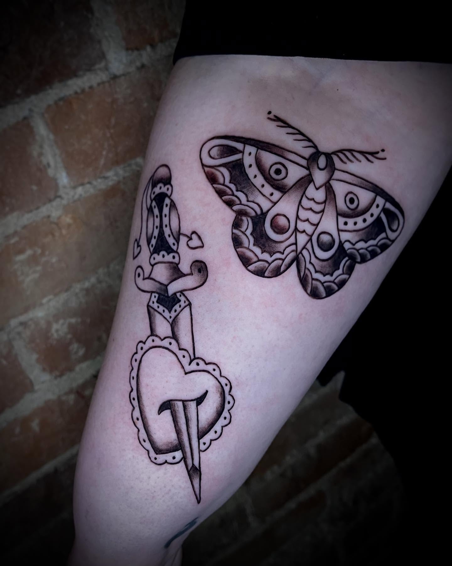 Moth and dagger American traditional tattoo on the thigh by Saint