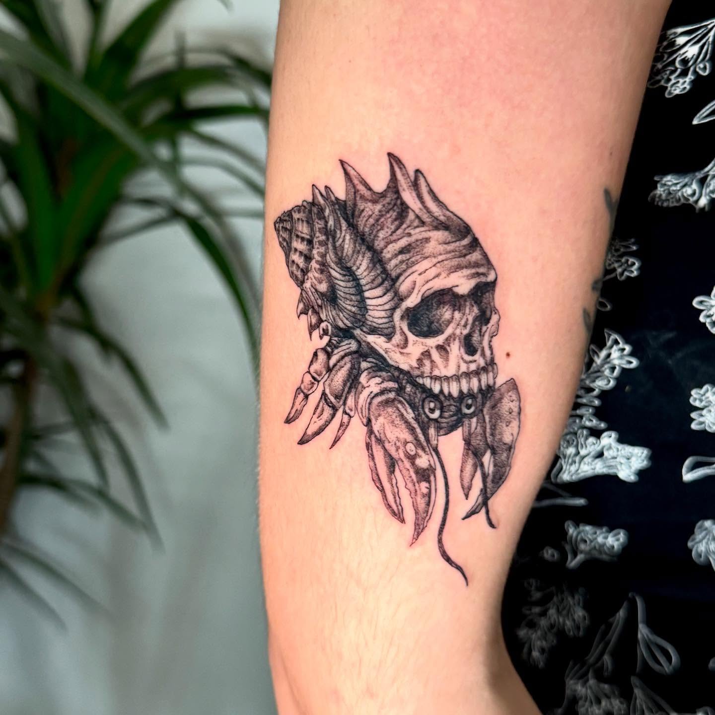 Skull with tentacles dark realism tattoo on the forearm by C.J. Pennington