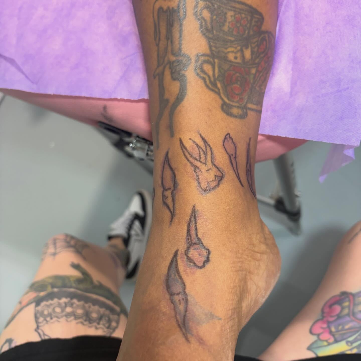 Rabbit and flowers American traditional tattoo on the forearm by Dont Worry About It