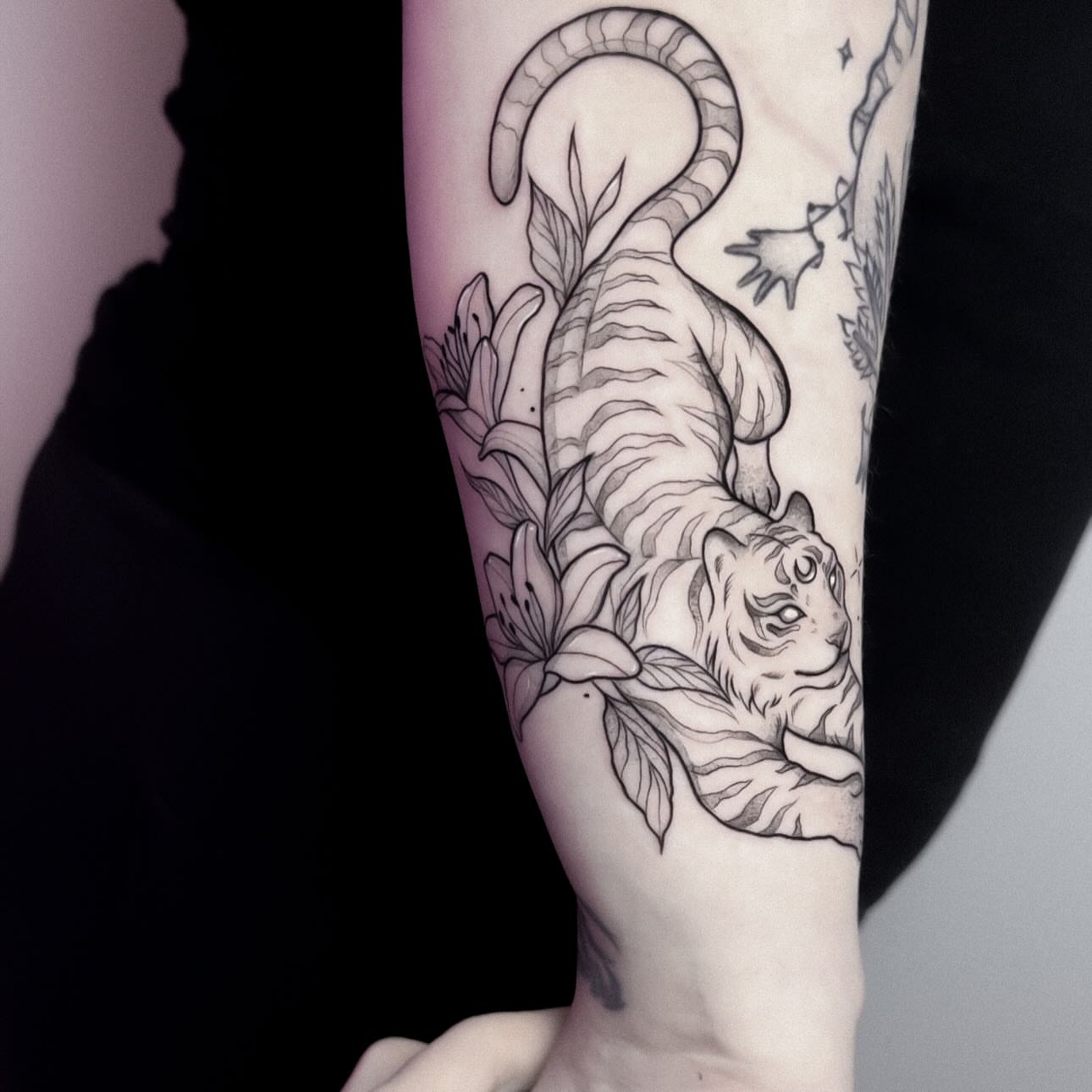 Tiger realism tattoo on the forearm by Whimsical Tattoos