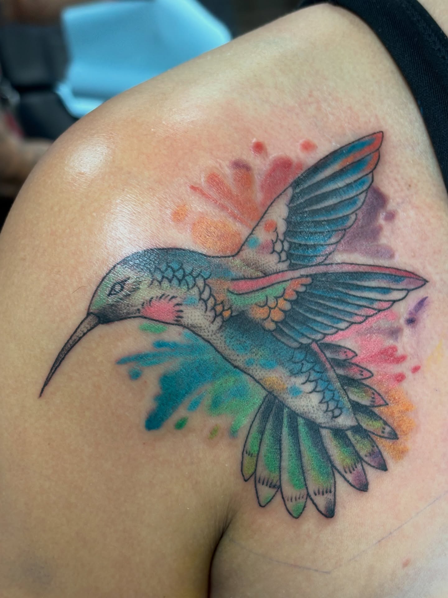 Hummingbird watercolor tattoo on the shoulder by Jason Allen, Avondale, Arizona